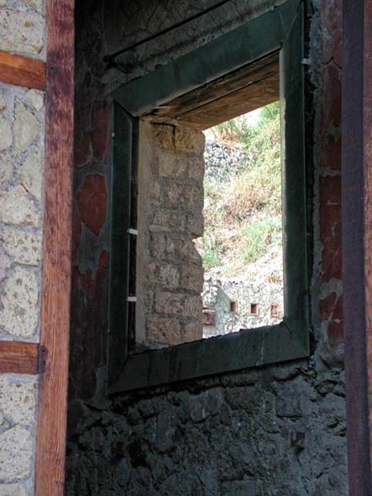 V.19/20, Herculaneum. September 2003. 
Looking towards window in north wall of upper floor cubiculum, overlooking Decumanus Maximus.
Photo courtesy of Nicolas Monteix.